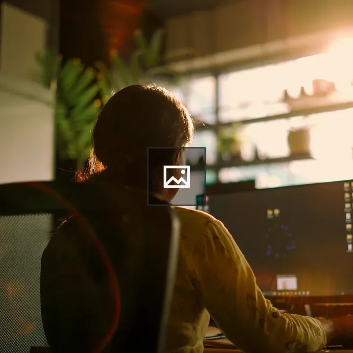 Girl at computer by window