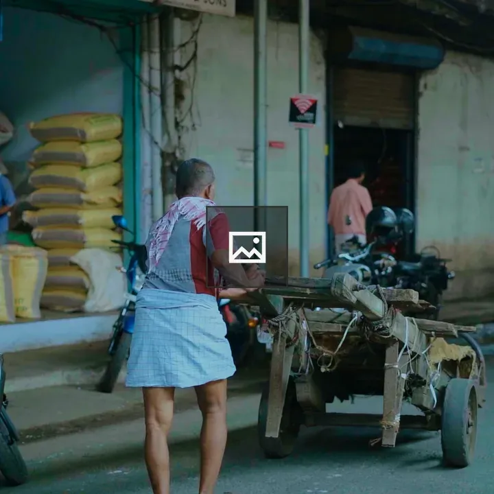 Man with cart among shops