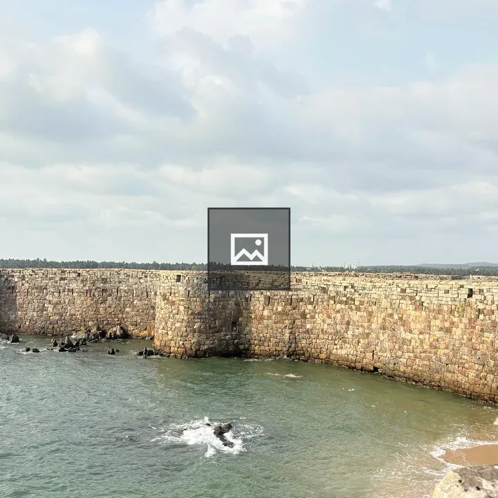 Curved Stone Wall Along Coast