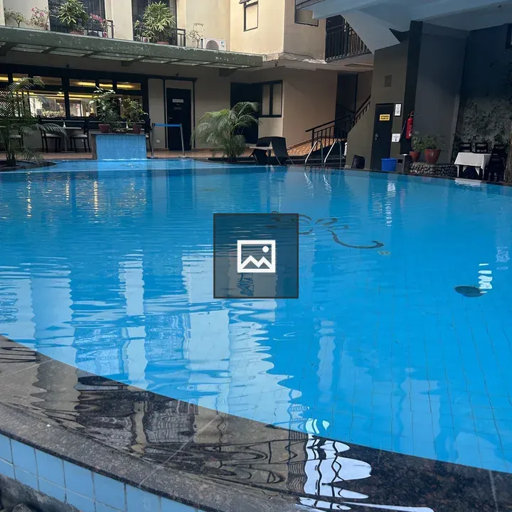 Indoor pool area with balconies