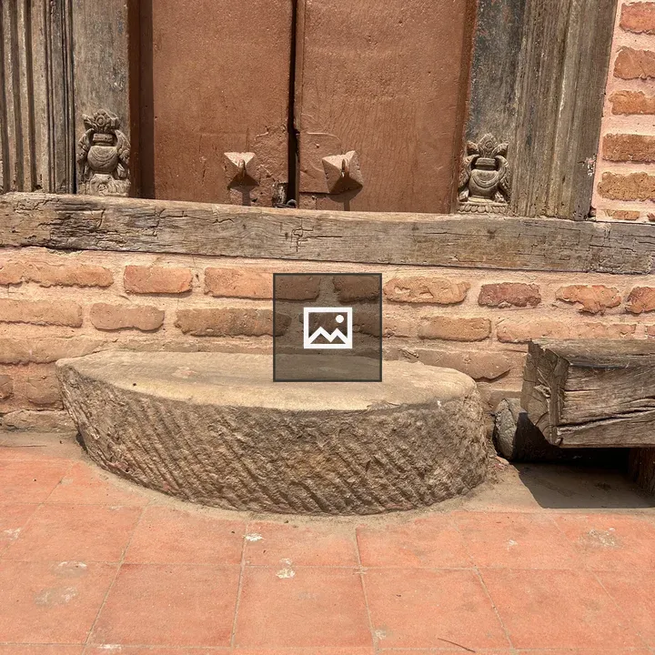 Rustic wooden door in brick wall