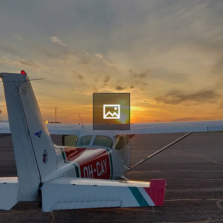 Small airplane at sunset