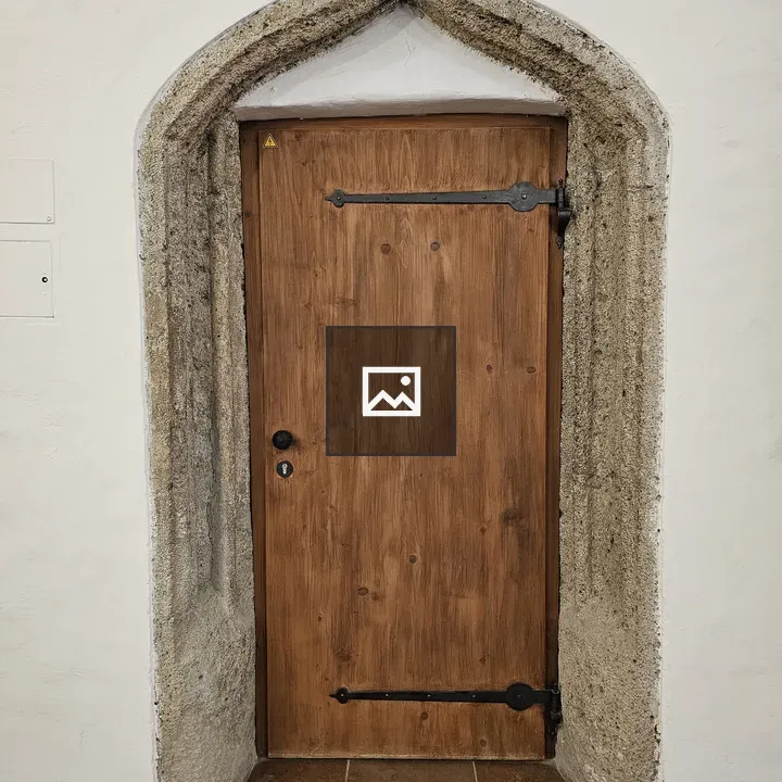 Wooden Door in Stone Arch