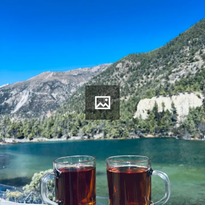 Two tea mugs on wooden ledge