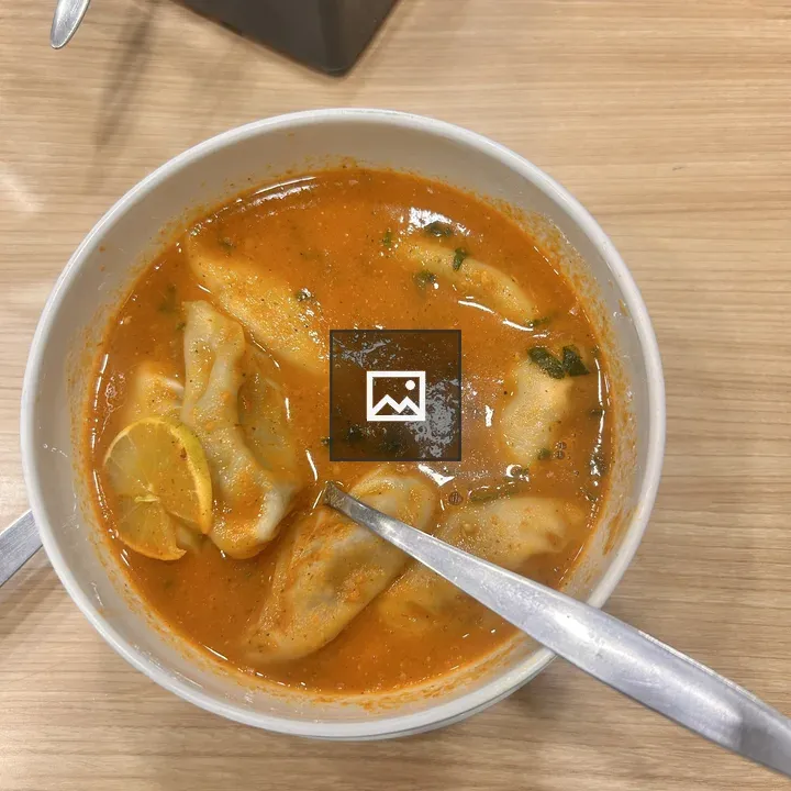 Orange soup with dumplings