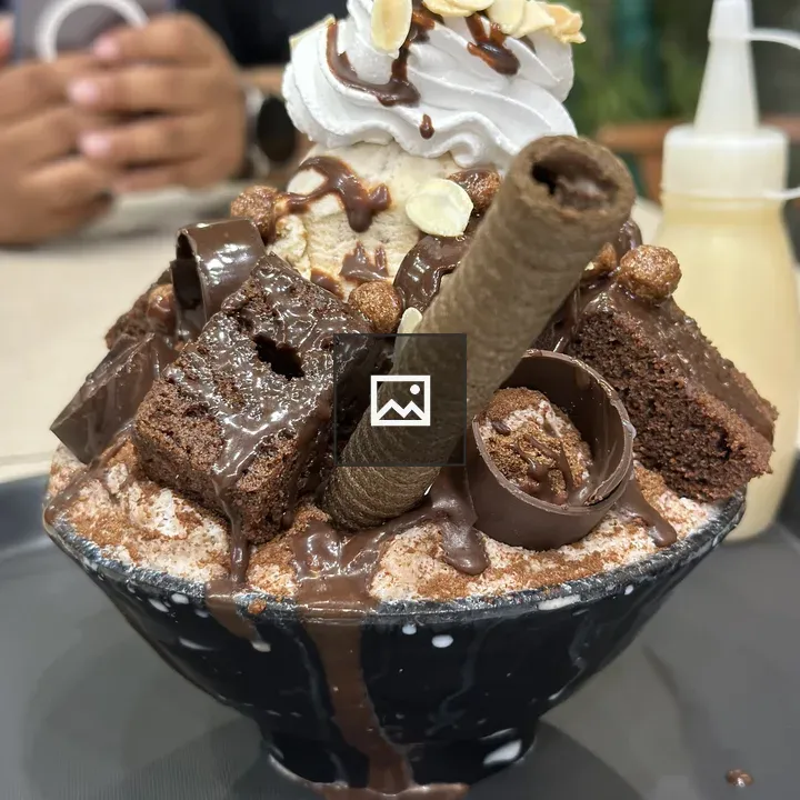 Ice cream dessert in brown bowl