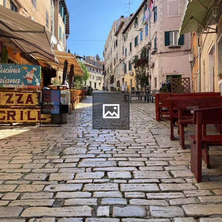 Croatian cobblestone street with outdoor dining
