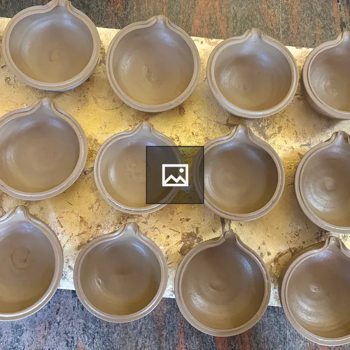 Unfinished clay bowls grid
