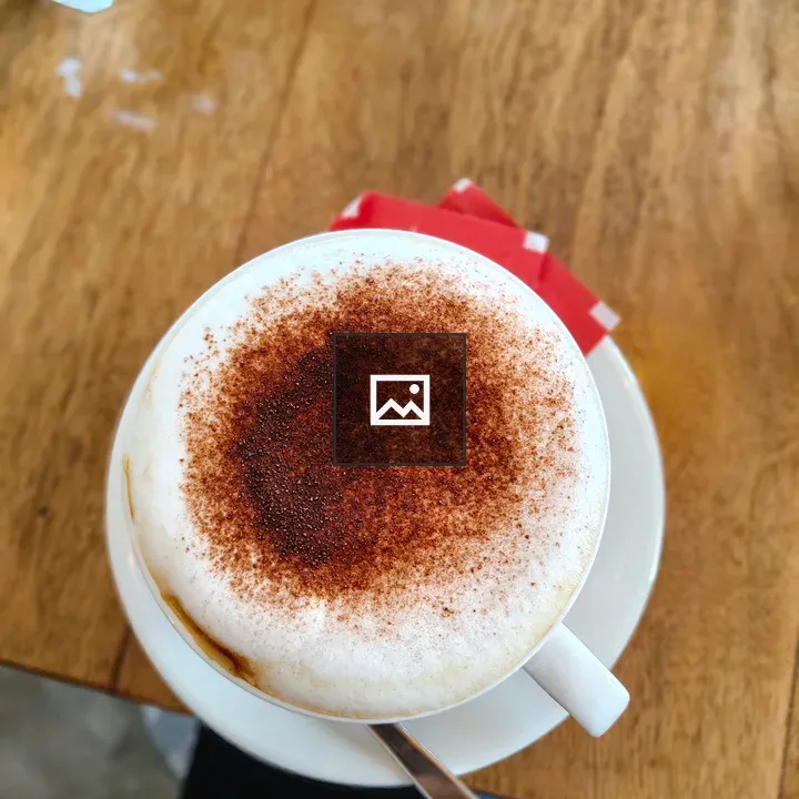 Coffee cup with foam and powder
