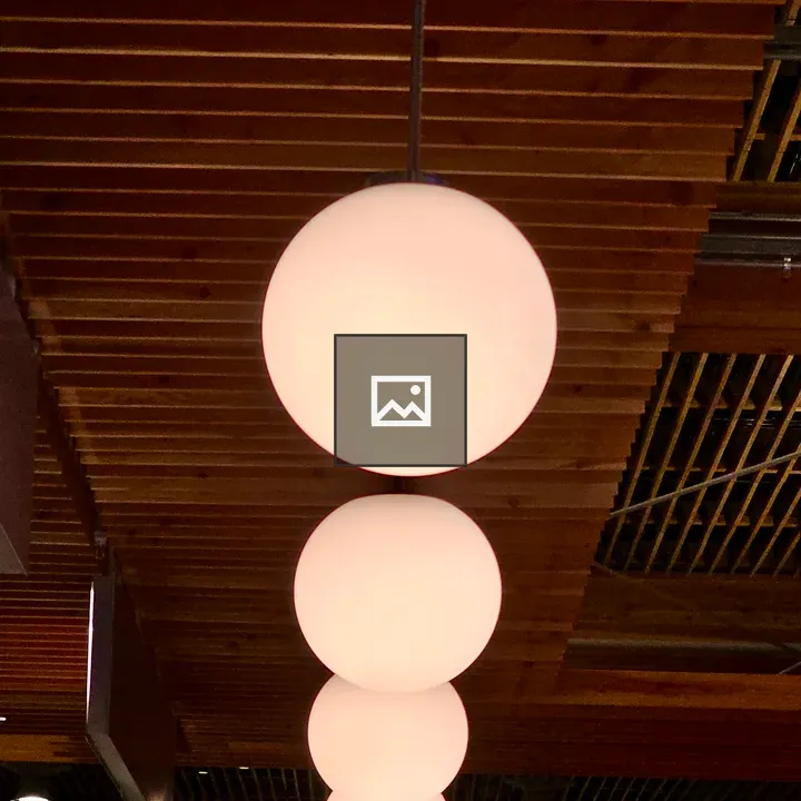 Glowing pendant lights in airport interior