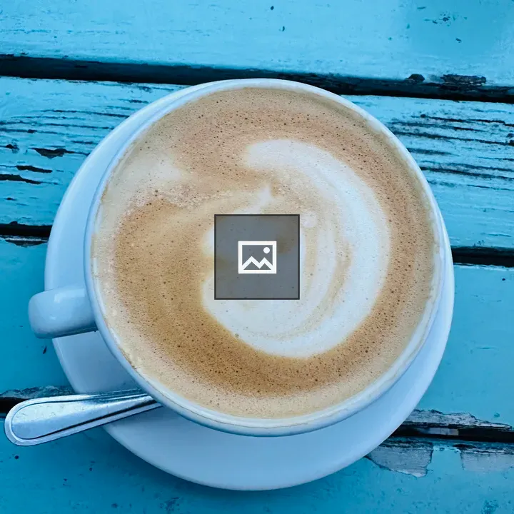 Cup of coffee on blue table