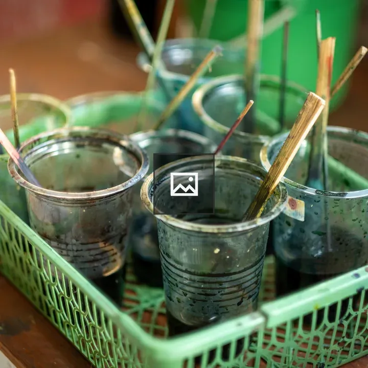 Plastic cups with dye for batik