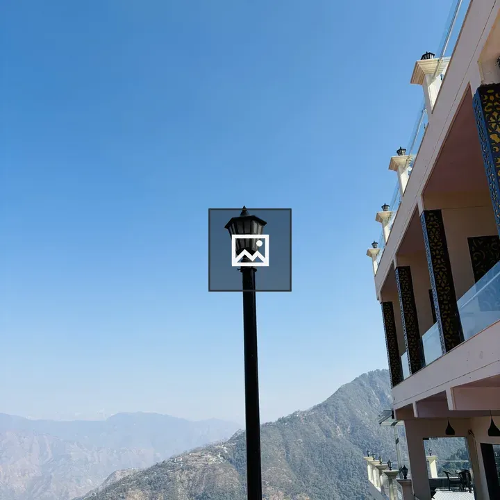 Lamp in foreground with mountain landscape