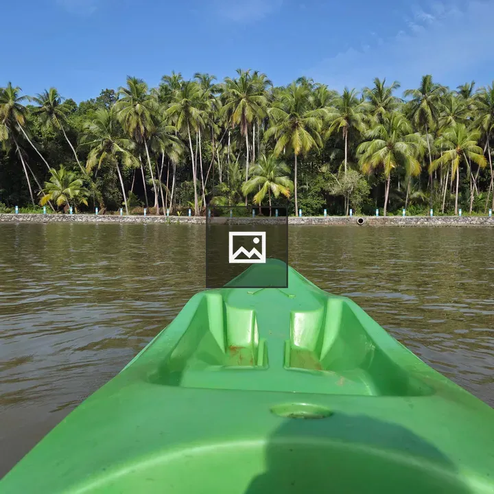 Green kayak on calm water