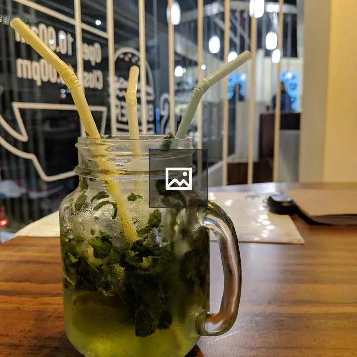 Mason jar mojito on wooden table