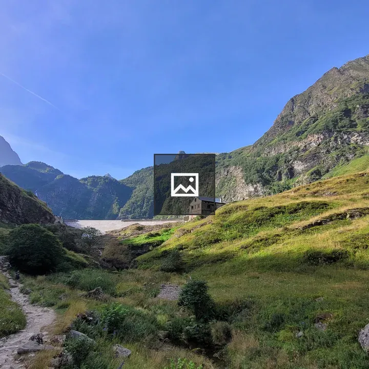 Mountain valley landscape with stone building