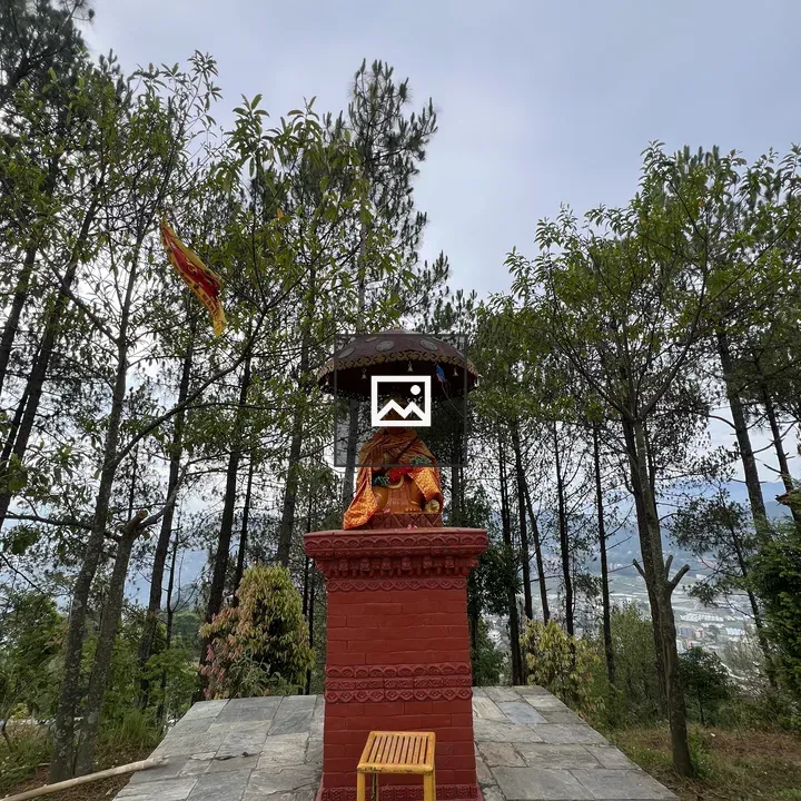 Hanuman statue under umbrella
