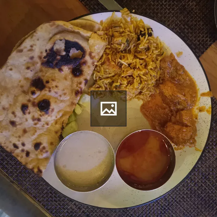 Plate of Indian Food with Naan and Curry