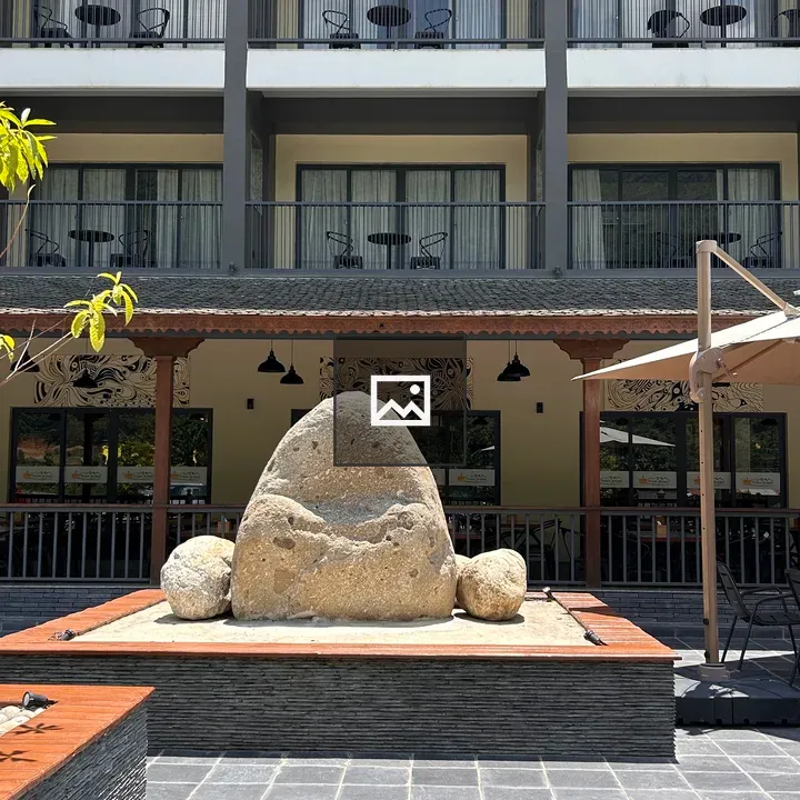 Stone sculpture in landscaped area