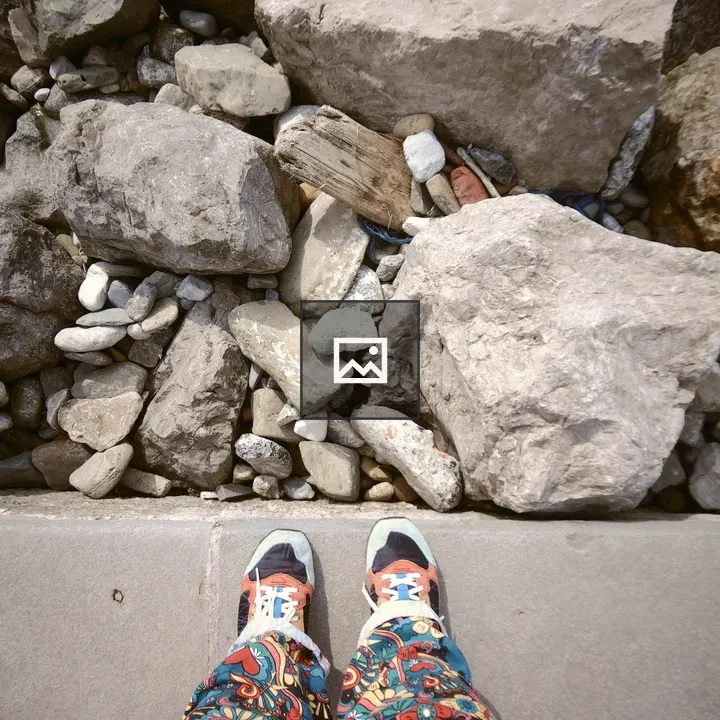 Person in Bright Patterned Pants and Shoes