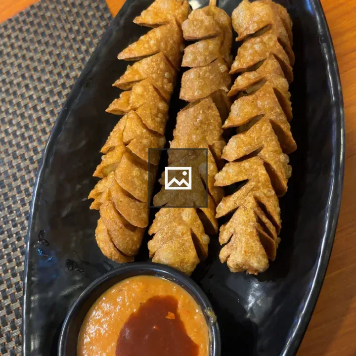 Three skewers of spiral-cut sausage