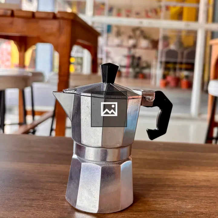 Moka pot on wooden table