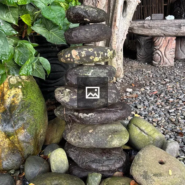 Pile of dark stones in garden