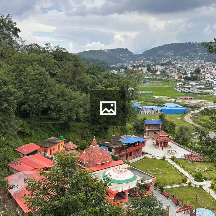 Hilly landscape with red rooftops
