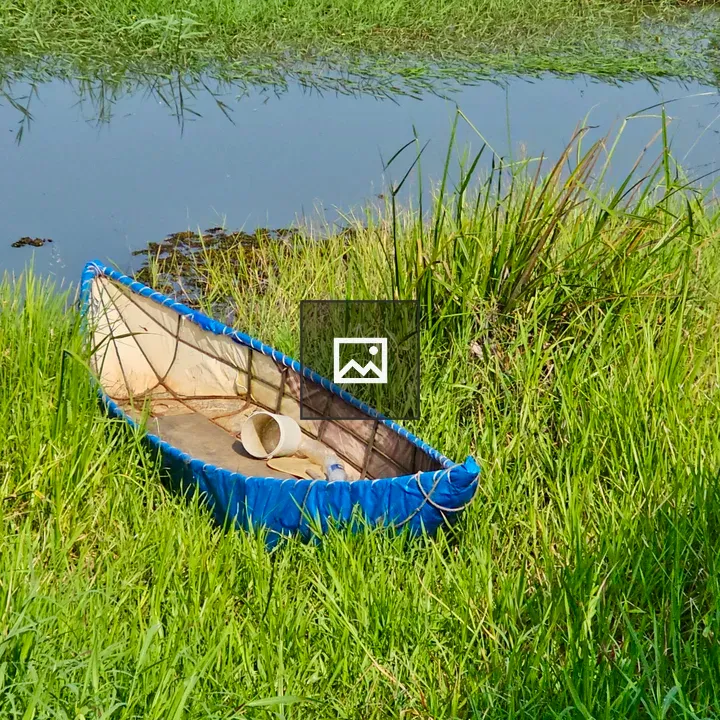 Fiber boat beside canal
