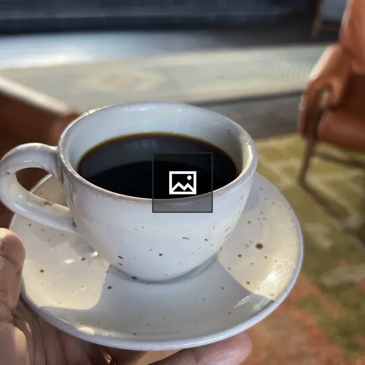 Hand with Coffee Cup