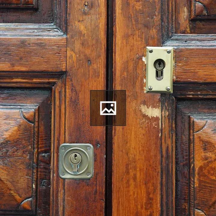Old wooden door with key holes