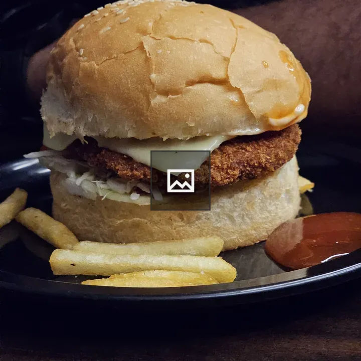 Chicken burger and chips closeup
