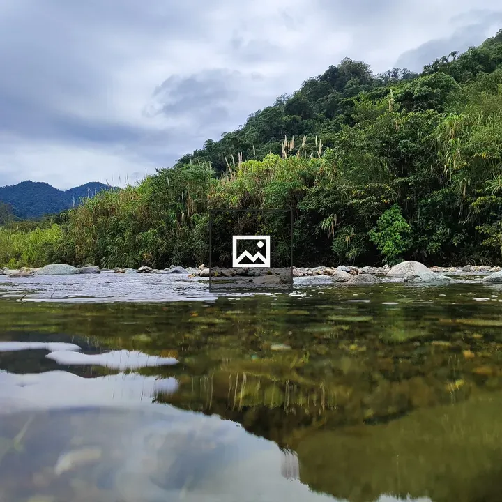 Calm river among green hills