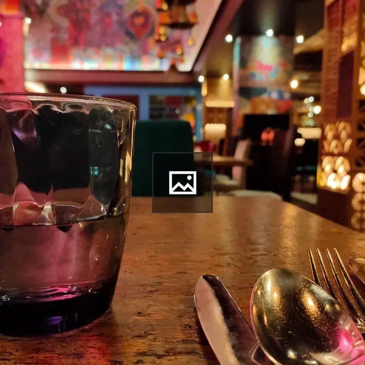 Glass with Cutlery on Table